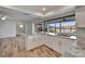 Open kitchen with granite countertops and a view of the canal, perfect for entertaining and relaxing at 6334 Cocoa Ln, Apollo Beach, FL 33572