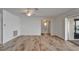 Bright living room with wood-look floors and a view of the pool at 6334 Cocoa Ln, Apollo Beach, FL 33572