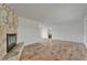 Bright living room with light wood flooring, a stone fireplace and neutral decor at 6334 Cocoa Ln, Apollo Beach, FL 33572
