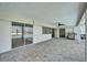 Covered patio with BBQ, views of the pool and waterfront at 6334 Cocoa Ln, Apollo Beach, FL 33572