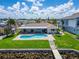 Aerial view of the kidney shaped pool and private backyard at 6334 Cocoa Ln, Apollo Beach, FL 33572