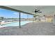 Covered outdoor patio with a view of a pool and waterfront at 6334 Cocoa Ln, Apollo Beach, FL 33572