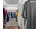 Organized walk-in closet with clothing racks and wood-look flooring at 6334 Cocoa Ln, Apollo Beach, FL 33572