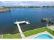 Waterfront backyard featuring dock and pool at 6334 Cocoa Ln, Apollo Beach, FL 33572