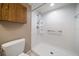 Clean bathroom showcasing a walk-in shower with grab bars, ensuring safety and accessibility at 6530 68Th N St, Pinellas Park, FL 33781