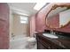 Bathroom features granite countertop, designer mirror, and tiled shower at 6530 68Th N St, Pinellas Park, FL 33781