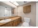 Well-lit bathroom featuring a large mirror, vanity, and a convenient walk-in shower at 6530 68Th N St, Pinellas Park, FL 33781