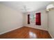 Bright bedroom features wood floors, large window, and ceiling fan at 6530 68Th N St, Pinellas Park, FL 33781