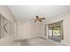 Relaxing bedroom featuring ceiling fan, carpet, and sliding glass doors offering views of the outdoor living area at 6530 68Th N St, Pinellas Park, FL 33781