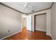 Cozy bedroom with wood floors, a ceiling fan, and a closet, providing a comfortable retreat at 6530 68Th N St, Pinellas Park, FL 33781