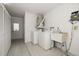 Functional laundry room includes washer, dryer, sink, and storage cabinets at 6530 68Th N St, Pinellas Park, FL 33781