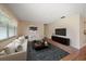Bright living room with neutral walls, modern furniture arrangement, and sleek hardwood flooring, creating a cozy space at 6530 68Th N St, Pinellas Park, FL 33781