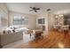 Open concept living room with wood floors, ceiling fan and neutral color pallette for a bright, comfortable space at 6530 68Th N St, Pinellas Park, FL 33781