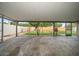 A covered patio that has a view of a fenced backyard at 6530 68Th N St, Pinellas Park, FL 33781
