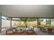 A covered patio with furniture and a view of the landscaped backyard at 6530 68Th N St, Pinellas Park, FL 33781