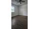 Bedroom features include a ceiling fan, window, and wood look flooring at 7107 Hernando Ct, Tampa, FL 33615