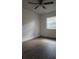 Cozy bedroom features include a ceiling fan and a window providing natural light at 7107 Hernando Ct, Tampa, FL 33615