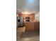 Bright kitchen with stainless steel refrigerator and updated appliances at 7107 Hernando Ct, Tampa, FL 33615