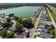 Aerial view of the community featuring a lake, a pool, well-maintained streets, and various homes at 8443 Fantasia Park Way, Riverview, FL 33578