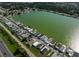 Aerial view of the community nestled along a lake surrounded by trees at 8443 Fantasia Park Way, Riverview, FL 33578
