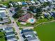 Aerial view showcasing community pool, clubhouse, and waterfront access at 8443 Fantasia Park Way, Riverview, FL 33578