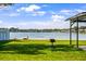 Backyard with lake view and grill at 8443 Fantasia Park Way, Riverview, FL 33578