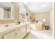 Bathroom featuring dual sinks, a large soaking tub, and tile floors at 8443 Fantasia Park Way, Riverview, FL 33578