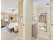 Hall view to stylish bedroom with soft textures, natural light and decor at 8443 Fantasia Park Way, Riverview, FL 33578