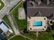 Aerial view highlighting community pool, basketball court, and waterfront access at 8443 Fantasia Park Way, Riverview, FL 33578