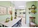 Bright dining room with modern lighting fixtures, and green walls, perfect for entertaining at 8443 Fantasia Park Way, Riverview, FL 33578