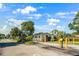 Community entrance with 'Lake Fantasia' sign, lush landscaping, and security features at 8443 Fantasia Park Way, Riverview, FL 33578