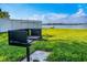 Community grill and green space near water offer outdoor cooking and enjoyment at 8443 Fantasia Park Way, Riverview, FL 33578
