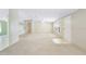 Spacious living room with neutral carpeting, built-in cabinets, and abundant natural light at 8443 Fantasia Park Way, Riverview, FL 33578