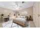 Cozy bedroom with a comfortable bed, stylish decor, and a bright window view at 8443 Fantasia Park Way, Riverview, FL 33578