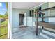 Covered porch area offering additional storage space and convenient access to the home at 8443 Fantasia Park Way, Riverview, FL 33578