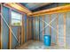 Unfinished storage area with exposed framing, offering potential for customization and expansion at 8443 Fantasia Park Way, Riverview, FL 33578