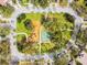 Aerial view of the community park and playground with sidewalk and trees at 10203 Shadow Branch Dr, Tampa, FL 33647
