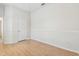 Cozy bedroom with base molding, ceiling fan, and door at 10203 Shadow Branch Dr, Tampa, FL 33647