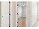 View from hallway into bedroom with ceiling fan and bright windows at 10203 Shadow Branch Dr, Tampa, FL 33647