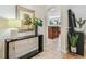 Inviting entryway with modern console table and decor, flowing into the open-concept living spaces at 10203 Shadow Branch Dr, Tampa, FL 33647