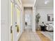 Light-filled foyer with tile flooring and view to the sitting room at 10203 Shadow Branch Dr, Tampa, FL 33647
