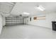 Spacious garage with epoxy flooring and garage door at 10203 Shadow Branch Dr, Tampa, FL 33647