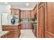 Traditional kitchen with tile floors, stainless steel appliances, granite countertops and wooden cabinets at 10203 Shadow Branch Dr, Tampa, FL 33647
