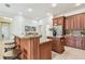 Spacious kitchen with granite countertops, stainless steel appliances, and a breakfast bar at 10203 Shadow Branch Dr, Tampa, FL 33647
