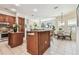 Open kitchen featuring granite countertops, stainless appliances, and seamless flow to dining area at 10203 Shadow Branch Dr, Tampa, FL 33647