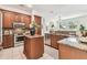 Gourmet kitchen with stainless steel appliances, granite countertops, and custom cabinetry at 10203 Shadow Branch Dr, Tampa, FL 33647