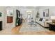 Open-concept living room with tile flooring, neutral decor, and an arched doorway to another room at 10203 Shadow Branch Dr, Tampa, FL 33647