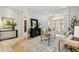 Open-concept living room with tile flooring, neutral decor, and an arched doorway to another room at 10203 Shadow Branch Dr, Tampa, FL 33647