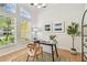 Bright office space with large windows, hardwood floors, and neutral wall color at 10203 Shadow Branch Dr, Tampa, FL 33647