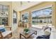 Covered patio with an outdoor kitchen, bar, and seating with a view of the pool at 10203 Shadow Branch Dr, Tampa, FL 33647